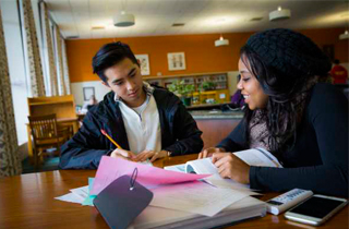 two students studying in the Alexander Library